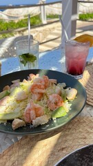 A symphony of flavors, a creamy Caesar salad adorned with succulent shrimp, lettuce, and crispy croutons, a culinary masterpiece that tantalizes taste buds.