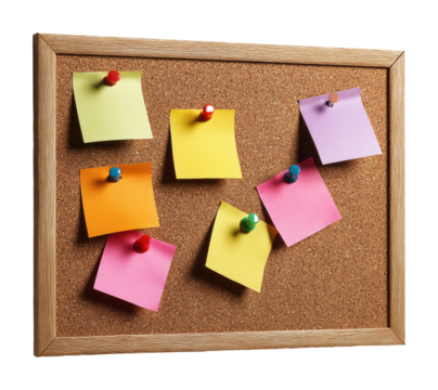 Organizing ideas with colorful sticky notes on corkboard office