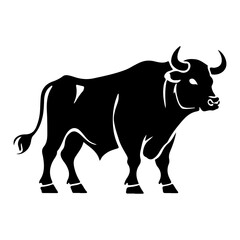 A powerful bull in silhouette standing with impressive horns and muscular build
