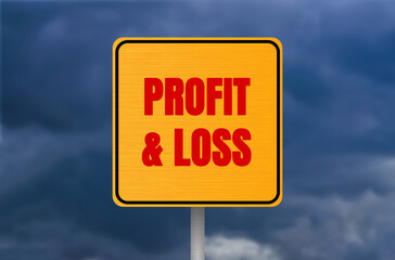 Profit and loss message written on metal sign on cloudy sky background. Conceptual profit and loss...