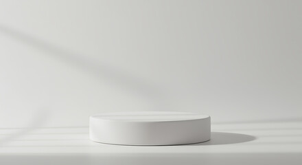 Minimalist white cylinder podium displaying product against a clean backdrop with soft shadows
