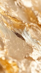 Obraz premium Golden metallic surface glimmering with radiant light, presenting sophisticated textural background for premium graphic design applications