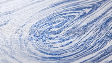 A close up of a blue and white patterned fabric