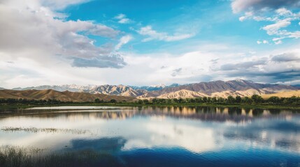 Fototapeta premium A large body of water with mountains in the background