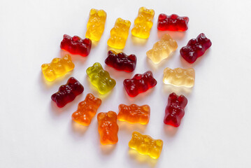 Colorful different Haribo gummy bears on white background
