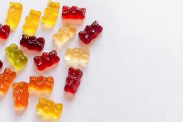 Colorful different Haribo gummy bears on white background