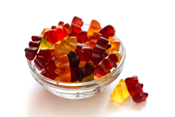 Colorful different Haribo gummy bears on white background