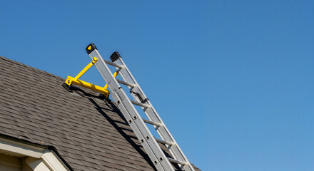 Ladder leaning on house roof ready for cleaning or inspection outdoor shot for safety and home maintenance visuals