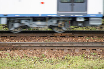  A bogie of a train moving at high speed with motion blur effect. High-speed train in motion on a railway track.