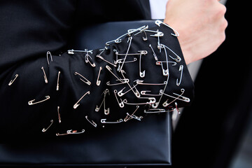Close-up of Avant-Garde Outfit Decorated with Safety Pins