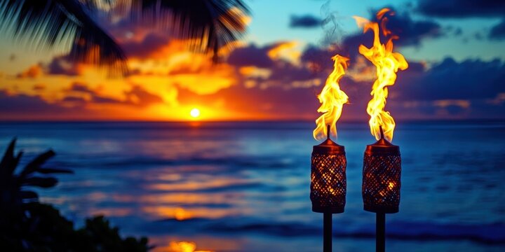 A vibrant sunset over the ocean with two tiki torches burning brightly in the foreground, framed by palm leaves. - Powered by Adobe