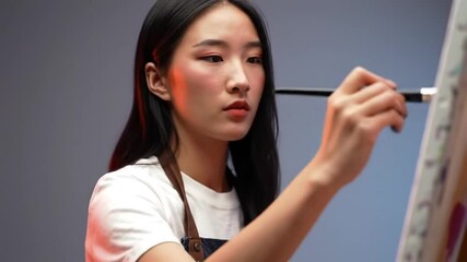 woman applying mascara - Powered by Adobe