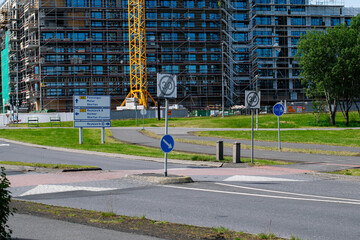 Urban development in Reykjavik with roads, buildings under construction, and greenery