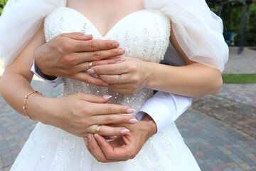 The newlyweds put wedding rings on each other's fingers. Wedding ceremony.