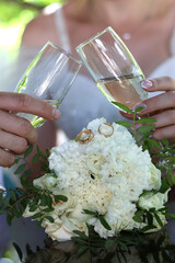 People toasting with glasses of white sparkling champagne