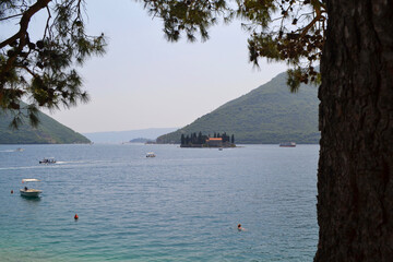 Iconic Island Church of Our Lady of the Rocks in Bay of Kotor, Montenegro, from Perast Coast