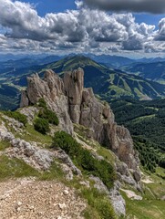 Fototapeta premium A Vast Mountain Range Unfurls Under a Sky of Dramatic Clouds