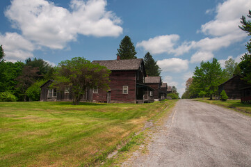 clapboard homes lining a dirt road in the historic eckley miners village in pennsylvania