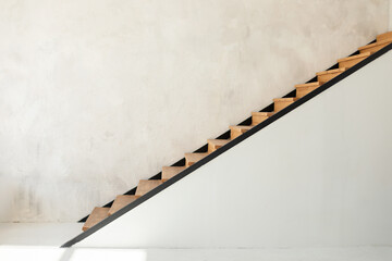 Stylish loft apartment modern home interior design with open staircase. Stairs made of the wood....