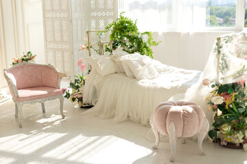luxury delicate vintage white bedroom with metal bed and pillows and linen in classic style. Shabby...