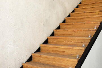 Stylish loft apartment modern home interior design with open staircase. Stairs made of the wood....