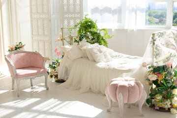 luxury delicate vintage white bedroom with metal bed and pillows and linen in classic style. Shabby...