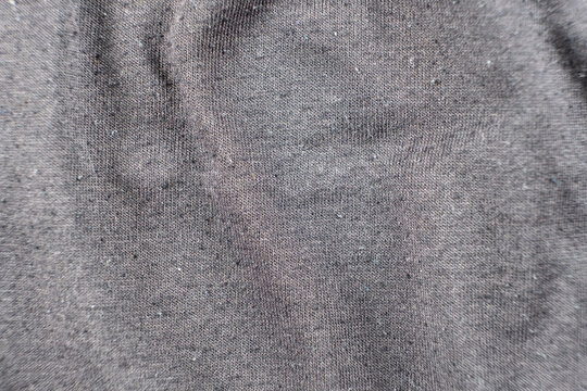 Old worn-out cotton fabric, pilling on a surface