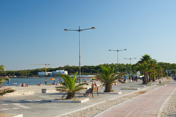 Touristical square with palm trees near San Cataldo beach, in Salento, Lecce, Apulia  Region, Italy