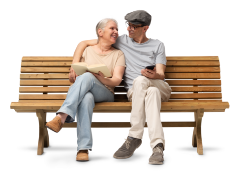 Happy Mature couple sitting closely together on a wooden bench, embracing while the woman reads a book and the man uses a smartphone. Studio image isolated on white background