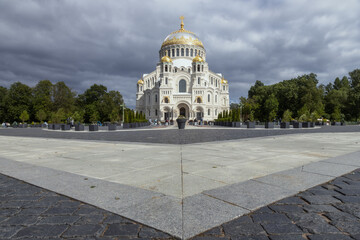 Kronstadt, Russia, 30.06.2025: Naval Cathedral with golden domes, dramatic sky