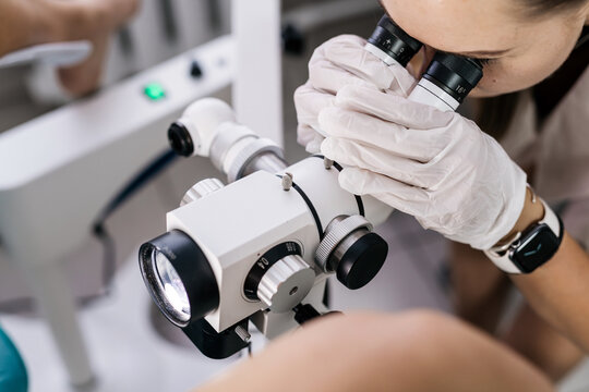 Close-up of gynecologist using a colposcope to examine the cervix. Concept advanced women’s healthcare and thorough examination