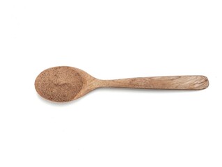 Cinnamon powder on wooden spoon isolated on white background. Flat lay.