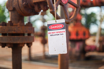Isolation tag or lockout tagout which is hanged on pipeline valve that under maintenance, do not...