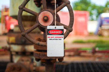 Isolation tag or lockout tagout which is hanged on pipeline valve that under maintenance, do not...