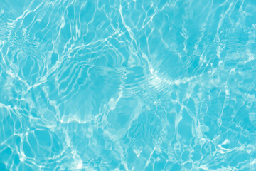 Blue water with ripples on the surface. Defocus blurred transparent blue colored clear calm water...