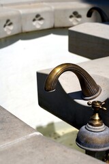 source of water with a tap. a water tap and a throttle valve for supplying water to a large source...