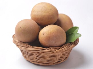 Sawo. Sapodilla fruit (Manilkara zapota) and other names such as sapota, or sawo. Isolated on white background with copy space. Sapodilla is tropical fruit and sweet taste fruit.