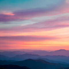 A beautiful mountain range with a pink and purple sky