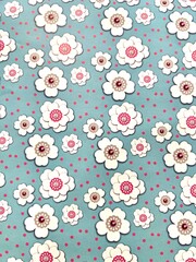 Vertical photo of beautiful white chamomile flowers on a soft light green background. Can be used as background, texture and background idea