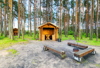 Summerhouse for rent on vacation at sea. Wooden house for recreation in nature. Camping area with Wooden gazebo for rest on river. Wooden Arbour for camping. Timber Wood Pavilion in forest at lake.