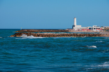 Touristic facilities and the lighthouse of San Cataldo coast, in Salento. Lecce, Apulia Region,...