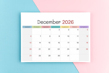 December 2026 calendar page on blue and pink color background.