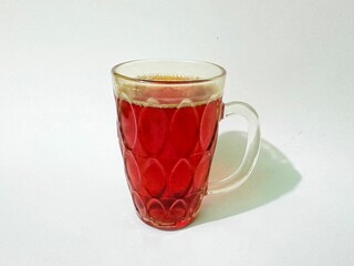 Cold turmeric drink, glass cup of turmeric drink. Glass of healthy turmeric drink on white background. Turmeric drink made from spices and can be used as medicine.