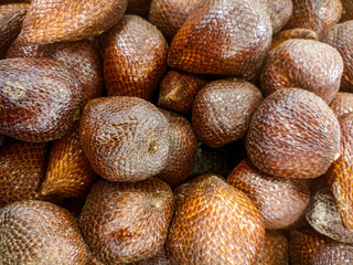 Fresh Salak (Snake Fruit / Salacca zalacca) texture. Delicious exotic tropical fruit background.