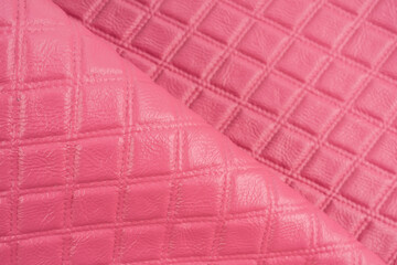 Pink leather texture as background.
