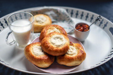 Creating a cozy breakfast scene featuring freshly baked pastries arranged on a decorative tray.