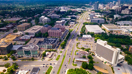Fototapeta premium Tysons VA Aerial View of Infrastructure and Growth Expanding commercial hub with high-rise architecture.