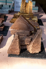 Stack of homemade cocoa halva with dried fruits.
