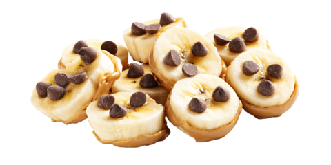 Delicious banana slices with peanut butter and chocolate chips on a black background Sweet and healthy snack concept for kids and adults