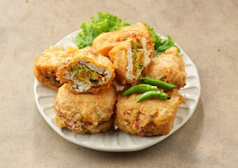 Tahu Isi. Stuffed tofu is known as fried food in the form of brown tofu filled with various fillings.